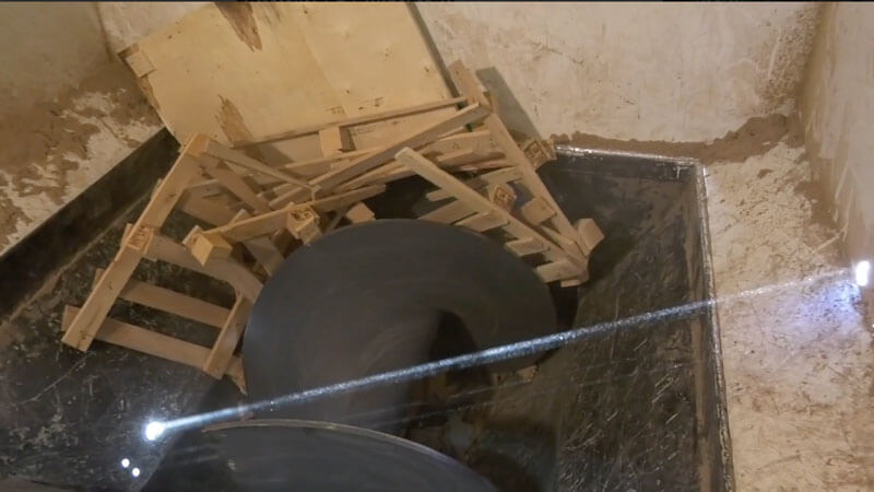 Watch trash compactor crush wooden pallet video
